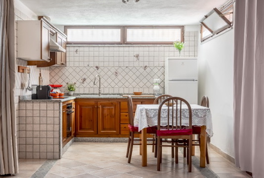 Villa Ornella — Angolo cucina e tavolo